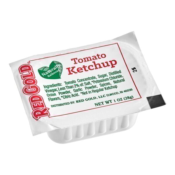 A single-serve 1 oz. cup of Red Gold Naturally Balanced Tomato Ketchup.