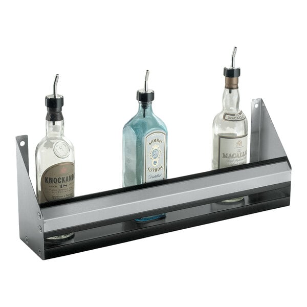 A stainless steel single tier speed rail holding three liquor bottles.