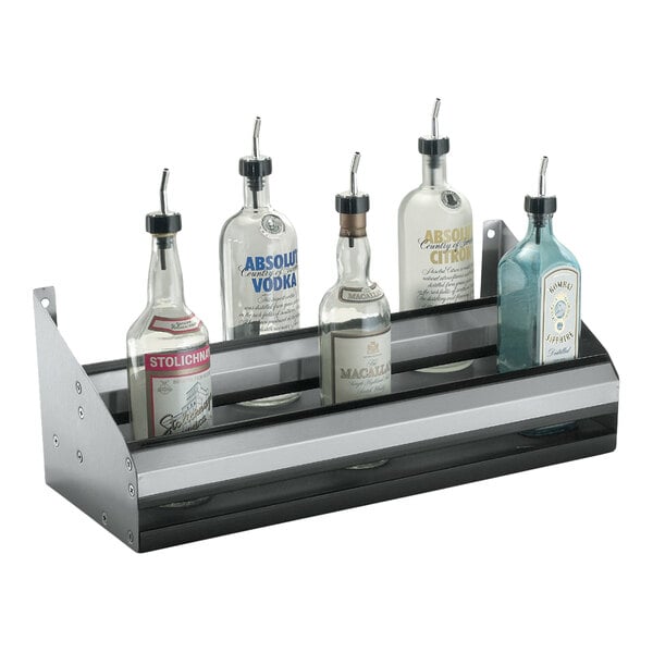 A stainless steel double tier speed rail holding several liquor bottles.