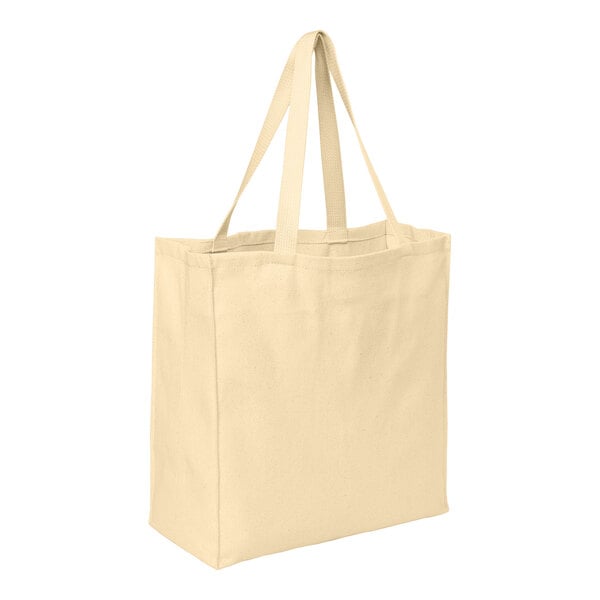 A natural-colored cotton twill over-the-shoulder grocery tote bag with two handles.