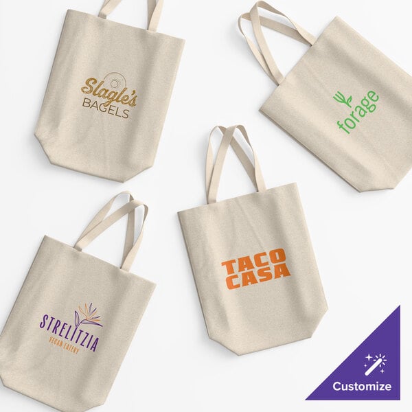 A set of natural cotton twill reusable tote bags with customizable printed logos and over-the-shoulder handles.