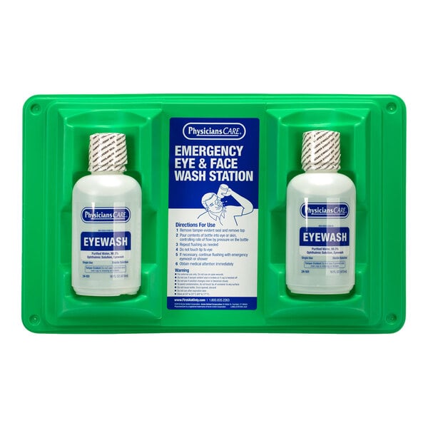 A double eyewash wall station with two 16 oz. bottles of eyewash solution mounted on a green plastic holder.