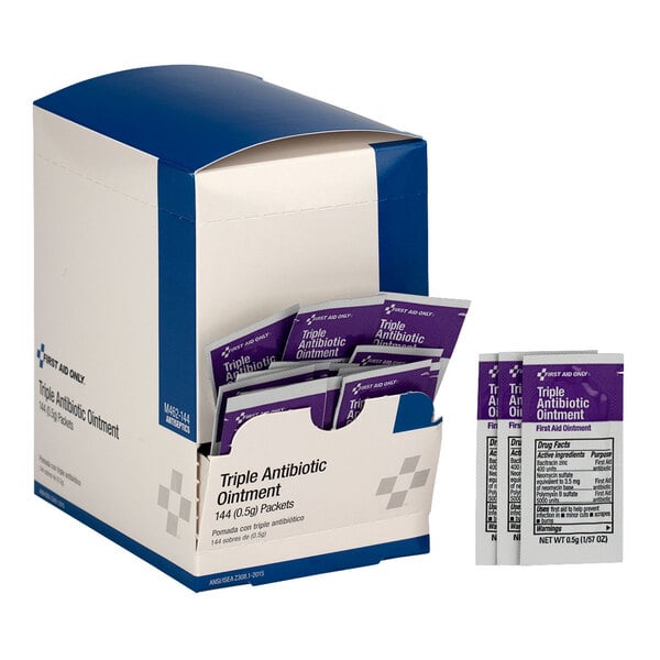 A box of First Aid Only triple antibiotic ointment packets, containing 144 individual 0.5g packets.