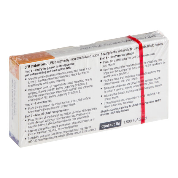 A plastic CPR mask with a one-way valve packaged in a clear wrapper with CPR instructions printed on the back.