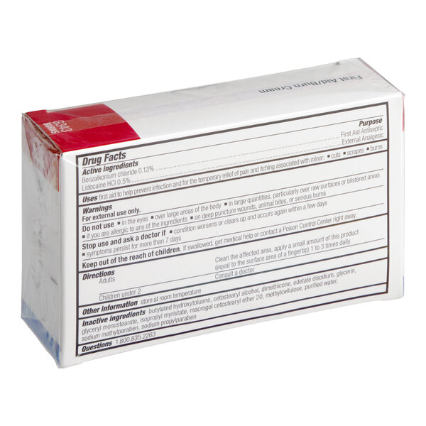 A box of First Aid Only 0.9 gram first-aid burn cream packets.