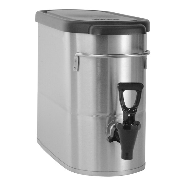 A stainless steel, narrow, low profile iced tea dispenser with a black lid and spigot.