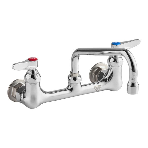 A chrome T&S wall mount faucet with two handles and two faucets.