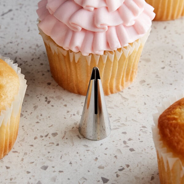 A metal ruffle piping tip used for cake and cupcake decorating.