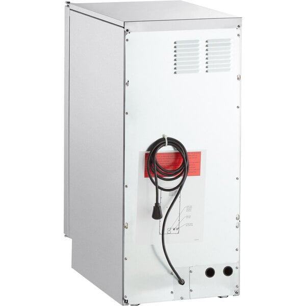 A stainless steel undercounter ice machine with a vented back panel and attached power cord.