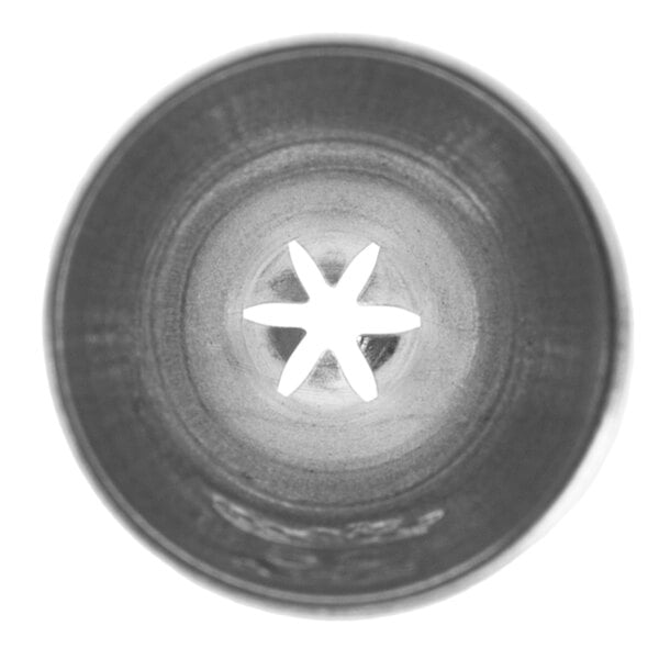 A metal closed star piping tip with a six-pointed star opening.