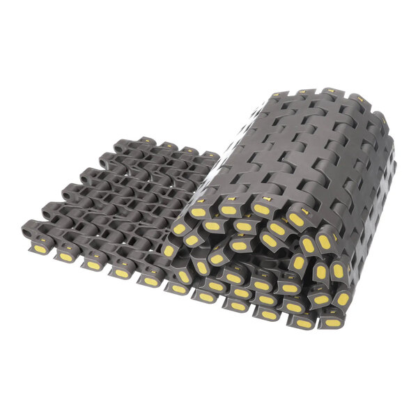 A rolled length of industrial plastic conveyor belt with interlocking segments and yellow accents.