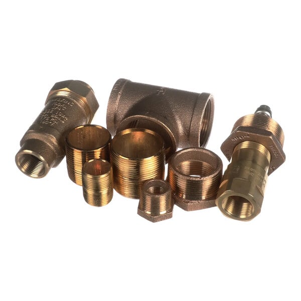 A set of brass plumbing fittings including a tee, reducers, and threaded inserts.