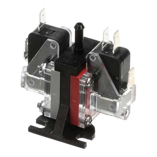 A dual pressure switch component with a black base, clear plastic covers, and metal terminals, used in Ice-O-Matic equipment.