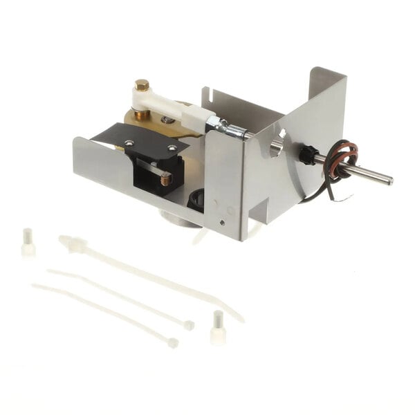 A metal and plastic Ice-O-Matic harvest kit assembly with attached wiring and included mounting accessories.