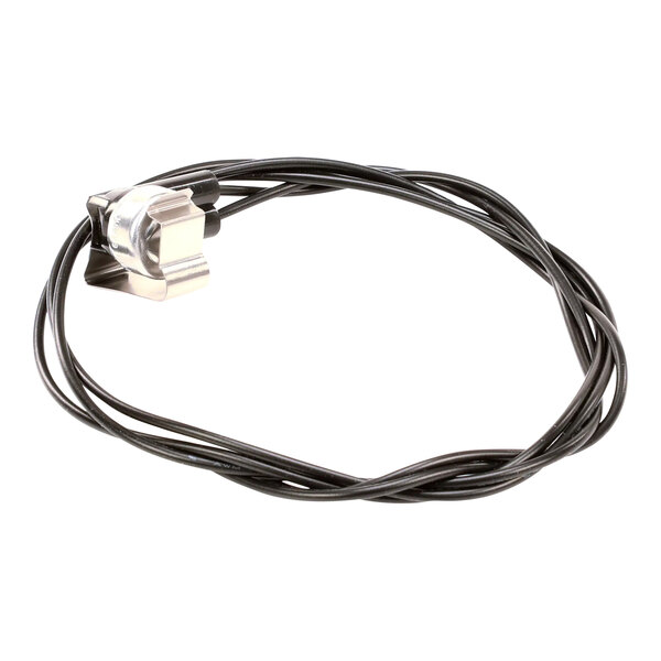 A high temperature switch with a metal component and attached black wiring.