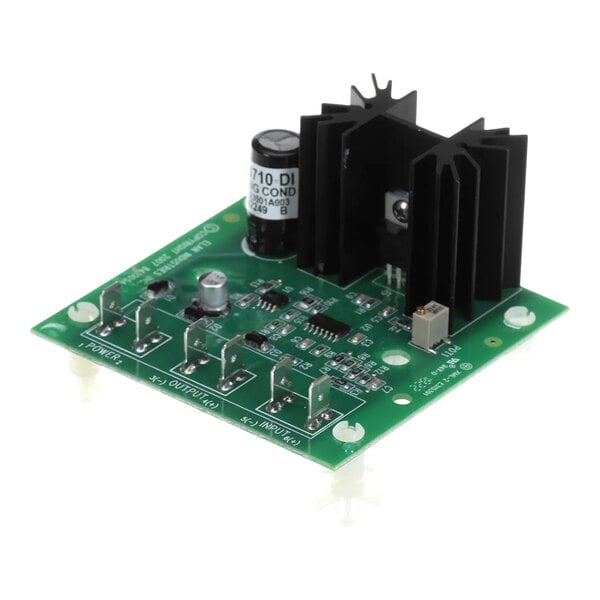 A green XLT Ovens SP4710A-DI signal conditioner circuit board with various electronic components and connectors.