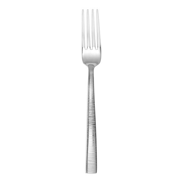 A stainless steel table fork with a textured handle.