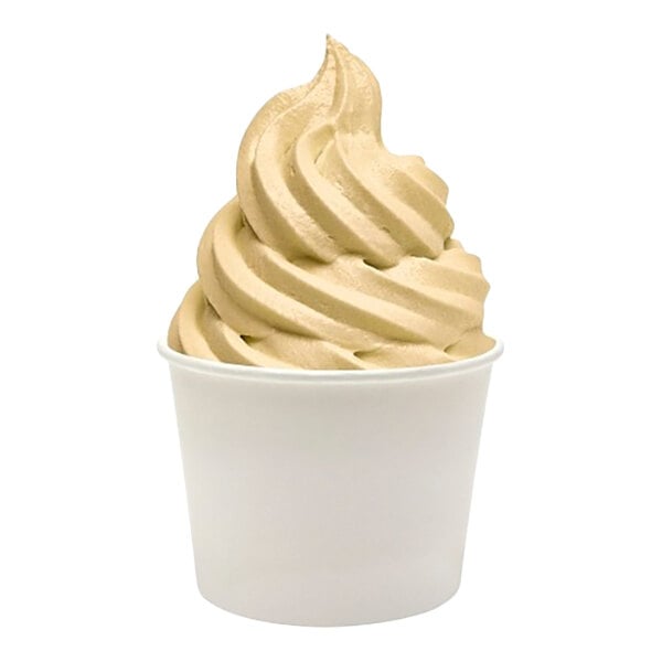 A serving of light brown soft-serve frozen yogurt in a plain white paper cup.