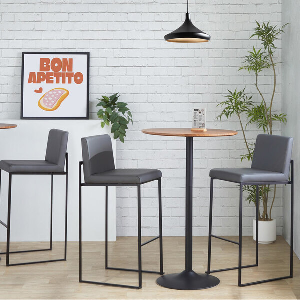 A pair of modern high-back barstools with black steel frames and gray faux leather upholstery.
