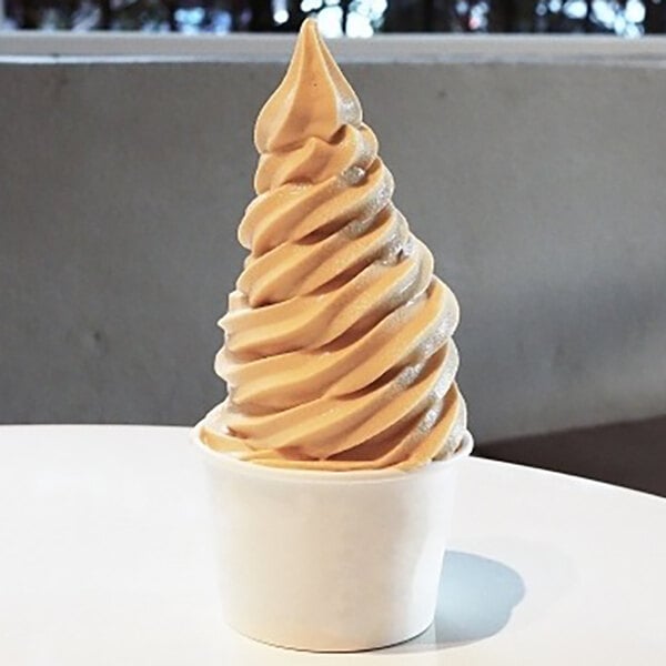 A cup of swirled dulce de leche frozen yogurt.