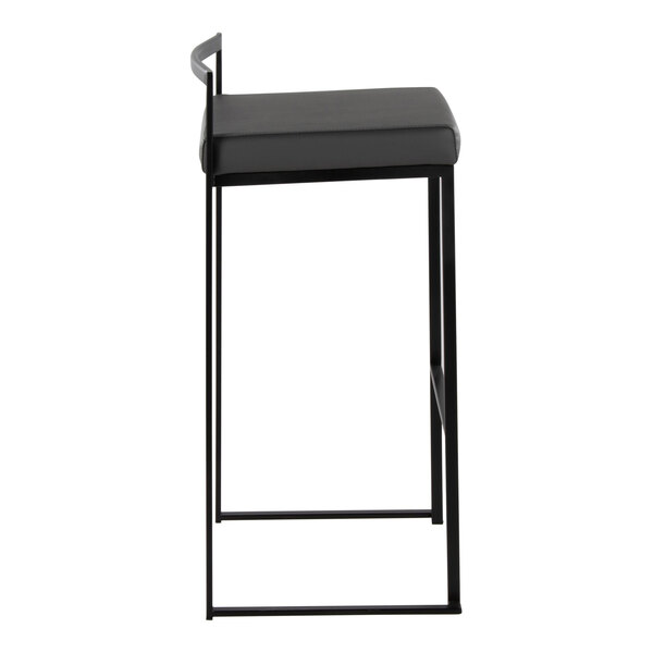 A modern black metal barstool with a low back and a gray faux leather seat.