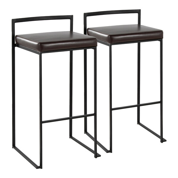 A pair of black metal stackable low-back barstools with brown faux leather seats.