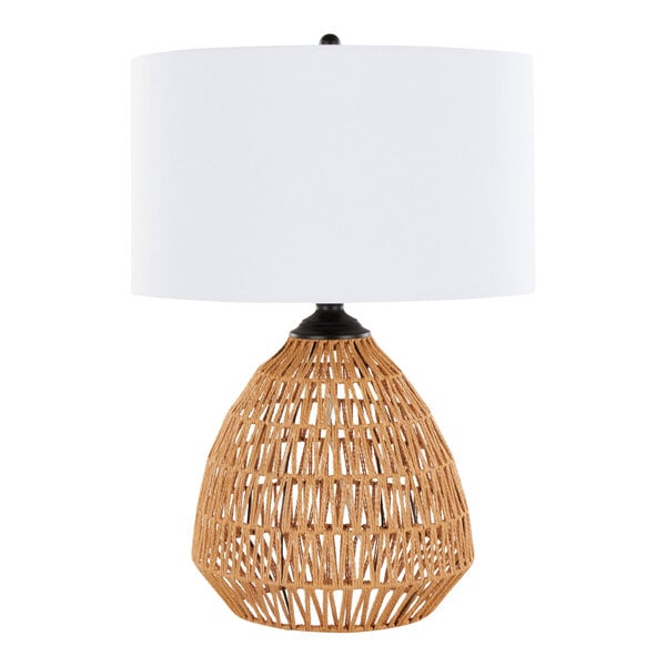 A table lamp with a natural rattan woven base and a white linen drum shade.