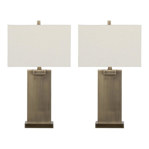 A pair of antique brass table lamps with rectangular white linen shades.