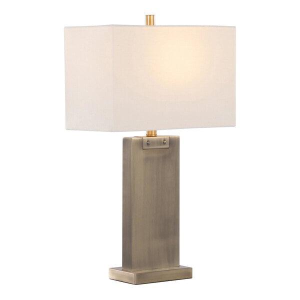 A rectangular table lamp with an antique brass base and a white linen shade.