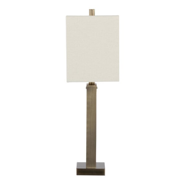 A table lamp with an antique brass rectangular base and a white linen rectangular shade.