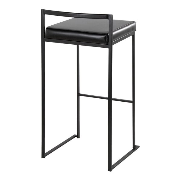 A black metal stackable low-back barstool with a black faux leather seat.