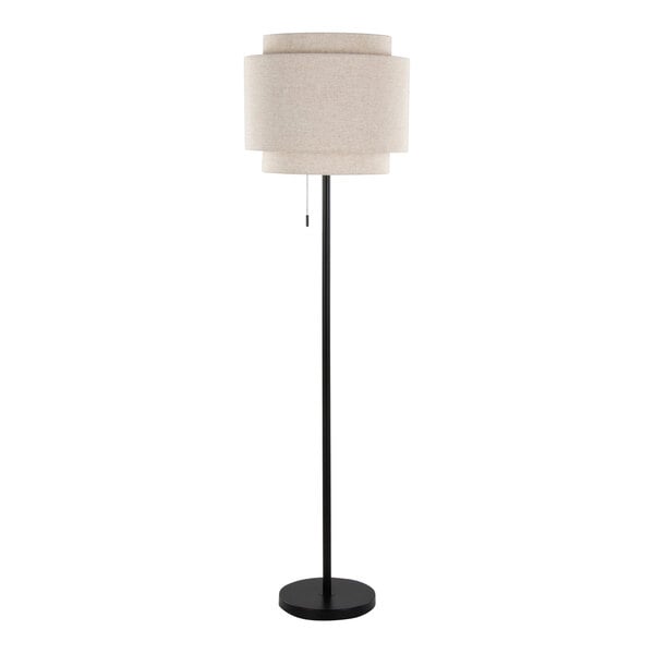 A black floor lamp with a beige linen tiered shade.