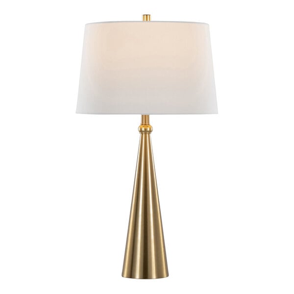 A gold table lamp with a conical base and a white linen drum shade.