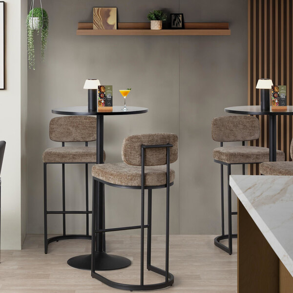 A pair of modern barstools with black metal frames and brown fabric upholstered seats and backs.