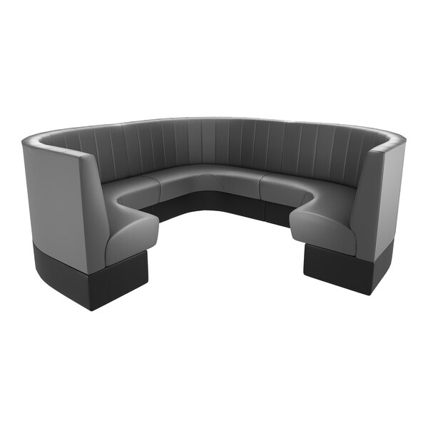 A large, graphite-colored, three-quarter circle booth with channel tufting and a 36-inch high backrest.