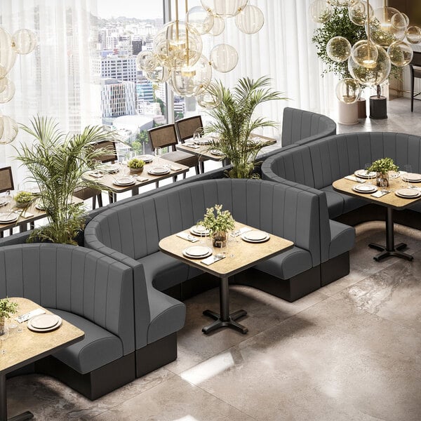 A large graphite-colored 3/4 circle booth with channel tufting and a 36-inch high back, designed for restaurant seating.