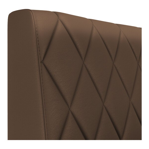 A brown diamond-tufted upholstered booth backrest.