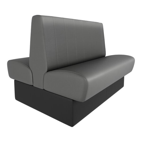 A double-sided booth seat with graphite-colored upholstery and a black base, featuring a high back and channel stitching.