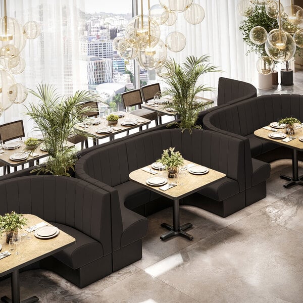 A 48-inch long, 36-inch high ebony channel quarter-circle corner booth with a modern design, shown in a restaurant setting.