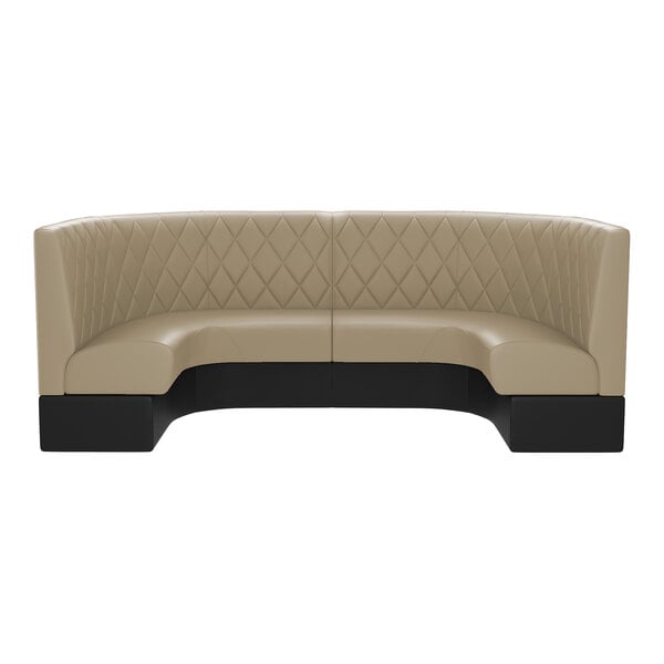 A large, half-circle booth with diamond tufted upholstery in a fawn color and a black base.
