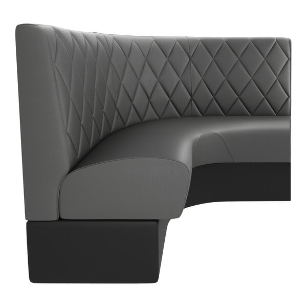 A graphite-colored, diamond-tufted, three-quarter circle booth with a high backrest.