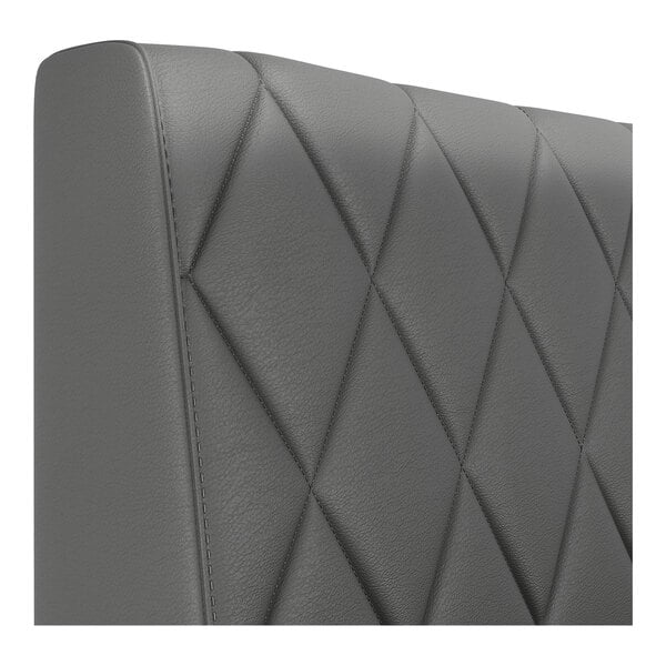 A graphite-colored, diamond-tufted upholstered booth backrest with a smooth, modern finish.