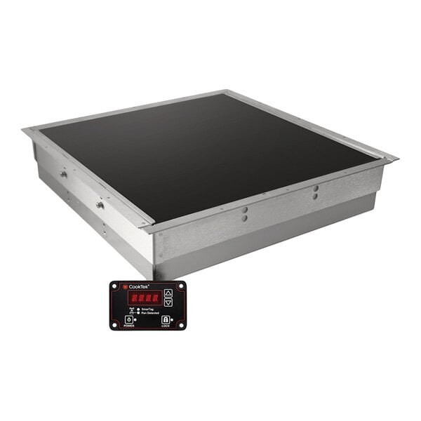 An undercounter induction warmer with a black surface and a separate digital control panel.