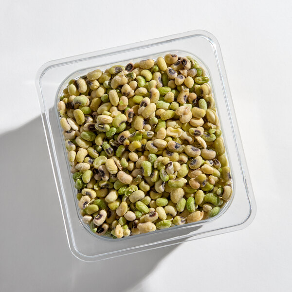 A clear container filled with individually quick frozen (IQF) black-eyed peas.