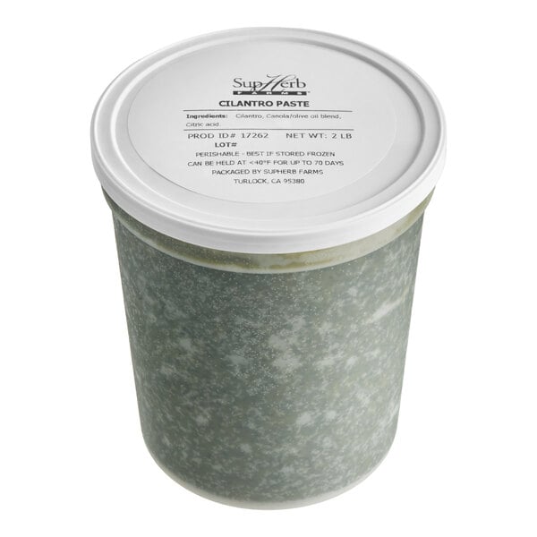 A 2-pound container of SupHerb Farms cilantro paste with a white lid.