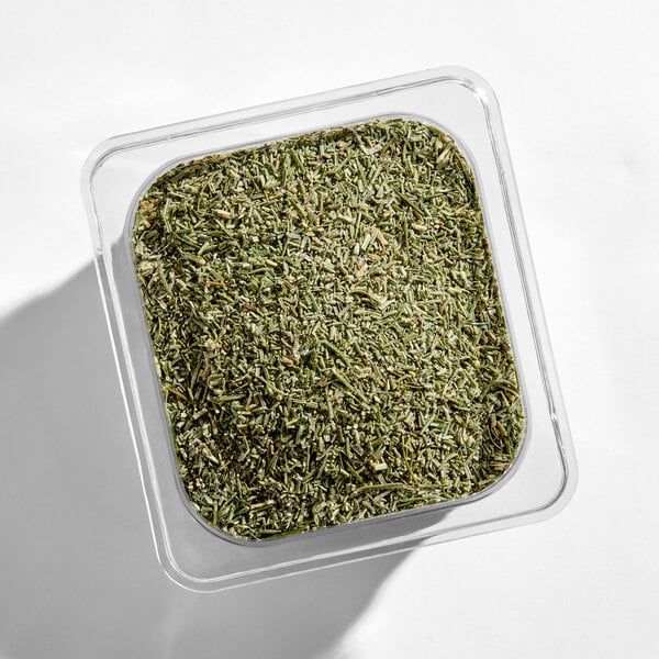 A container of chopped rosemary herb.