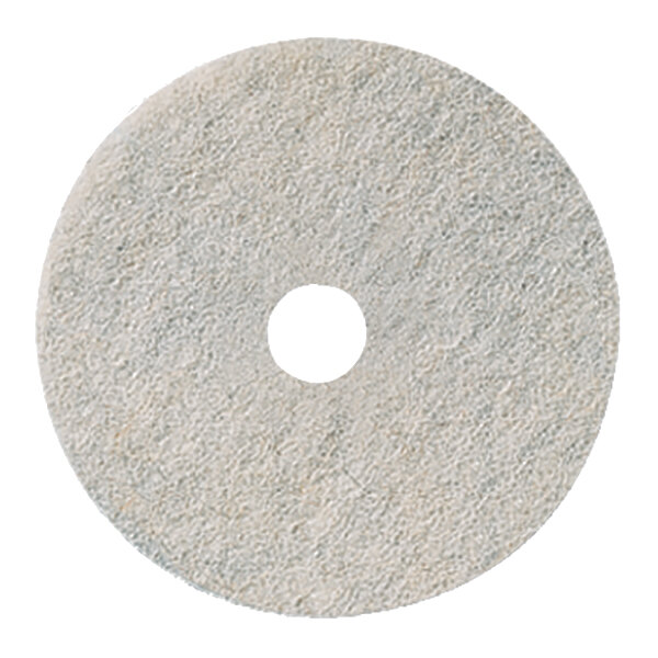 A round, white, textured floor burnishing pad with a central hole.