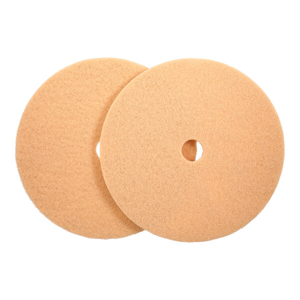 A pair of large, round tan floor burnishing pads with a central hole, designed for use with low-frequency floor machines.