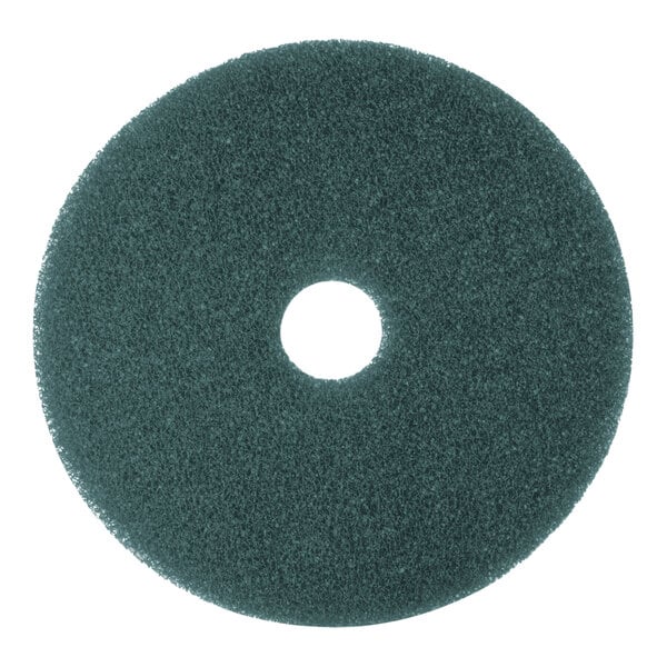 A round blue cleaning floor pad with a central hole, designed for use with floor cleaning machines.