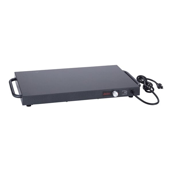 A rectangular titanium stainless steel warming shelf with side handles, a control knob, and an attached power cord.